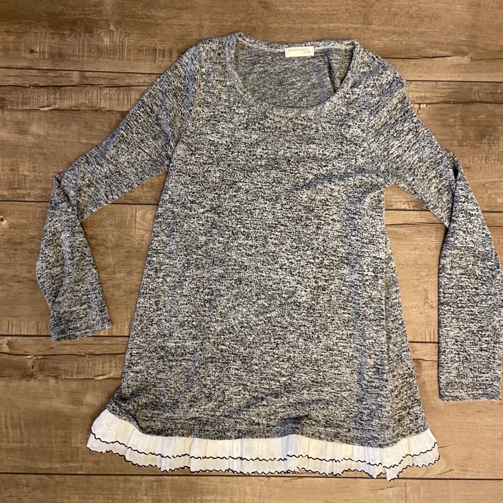 Tunic length sweater with white trim from boutique
